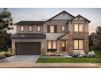 Charming two-story home showcasing stone accents, a two car garage, and manicured front lawn at 8465 Silverton Ln, Littleton, CO 80125