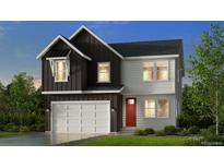 Charming two-story home with a two-car garage and a mix of dark and light siding at 13374 Blue Amber Ct, Parker, CO 80134