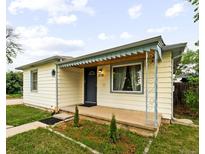Charming ranch home with a well-manicured lawn and updated facade at 2701 S Hazel Ct, Denver, CO 80236