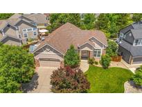 Inviting exterior view of a single-Gathering home with a well-manicured lawn and mature trees at 3494 S Otis Ct, Lakewood, CO 80227