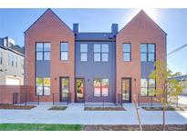 Charming brick townhomes with eye-catching windows, front stoops, and modern design at 5142 W 44Th Ave, Denver, CO 80212