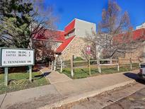 Attractive exterior of a brick building with a red roof at 14751 E Tennessee Dr # 226, Aurora, CO 80012