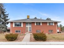 Charming brick home with a well-manicured lawn and inviting entrance, perfect for a Gathering at 4731 W 66Th Ave, Arvada, CO 80003