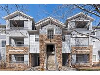 Attractive exterior view of a multi-Gathering home with stone accents, balconies, and well-maintained landscaping at 5255 Memphis St # 1112, Denver, CO 80239