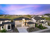 Stunning two-story home showcasing manicured landscaping, a spacious driveway, and an attached two-car garage at 455 Rogers Way, Castle Rock, CO 80104