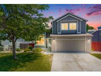Charming two-story home featuring a well-maintained lawn and an attached two-car garage at 4422 E Andover Ave, Castle Rock, CO 80104