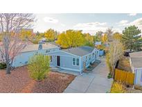 Charming single-Gathering home featuring a well-manicured yard and inviting entrance in a mature neighborhood at 5541 Umatilla St, Denver, CO 80221