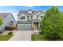 Charming two-story home boasts a well-manicured lawn, inviting curb appeal, and an attached two-car garage at 3717 Desert Ridge Cir, Castle Rock, CO 80108