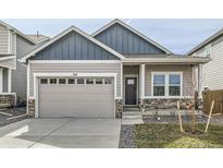 Charming home with a neutral color palette, stone accents, and an attached two-car garage at 754 Anderson St, Lochbuie, CO 80603