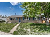 Charming single-story home featuring blue shutters and a well-maintained front yard at 7301 Dale Ct, Westminster, CO 80030