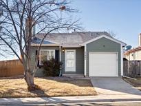 Charming single-story home with a well-manicured lawn and an attached one-car garage at 17990 E Cornell Dr, Aurora, CO 80013