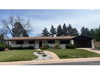 Charming single story home with well-manicured lawn and tasteful landscaping at 5886 S Logan St, Centennial, CO 80121