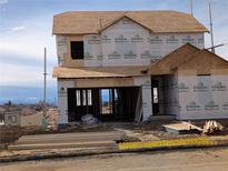 New home under construction featuring a two-story layout and mountain views at 16835 Mckay Dr, Mead, CO 80542