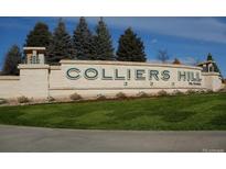 Stone entrance sign to Colliers Hill community with manicured lawn and blue skies at 1178 Hargreaves Way, Erie, CO 80516