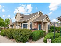 Charming, well-maintained home with mature landscaping and inviting curb appeal on a sunny day at 2164 S Troy Way, Aurora, CO 80014