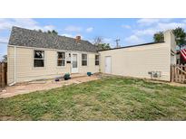 Cozy home featuring a well-maintained lawn and neutral exterior paint at 150 N 7Th Ave, Brighton, CO 80601