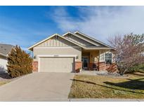 Beautiful Ranch style home with attached two-car garage and landscaped yard at 20697 E Lake Ave, Centennial, CO 80016