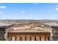 Expansive view from the porch showcasing the neighborhood and mountain ranges in the distance at 1995 Wingfeather Ln, Castle Rock, CO 80108