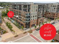 Brick building with sidewalks, shopping, and street parking featuring Castle Rock views at 20 Wilcox St # 318, Castle Rock, CO 80104