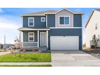 Two-story house with gray siding, white trim, and a two-car garage at 2245 Base St, Fort Lupton, CO 80621