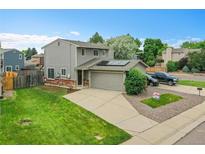 Well maintained two-story home with an attached two-car garage and solar panels at 12651 Elm St, Thornton, CO 80241