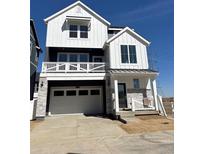 Charming two-story home featuring white siding, a balcony, and a two-car garage at 2140 S Haleyville Way, Aurora, CO 80018