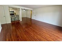 Spacious living room with hardwood floors and bright natural light at 12166 Melody Dr # 202, Denver, CO 80234