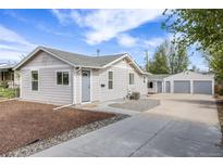 Charming single-Gathering home with well-maintained front yard and detached two-car garage at 3249 W Alaska Pl, Denver, CO 80219