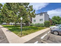 Well maintained apartment building exterior featuring mature trees and landscaping at 16259 W 10Th Ave # K1, Golden, CO 80401
