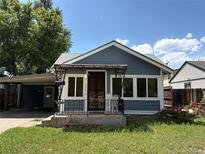 Charming single-story home with blue siding, a small porch, and a well-maintained front yard at 1337 Valentia St, Denver, CO 80220