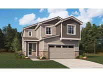 Charming two-story home featuring stone accents, a two-car garage, and well-manicured lawn at 11205 Mount Emma Dr, Englewood, CO 80112
