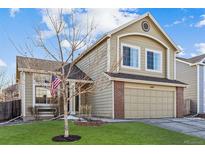 Charming two-story home with a manicured front lawn and two car garage at 4774 Coker Ave, Castle Rock, CO 80104