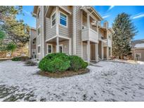 Exterior view of condo building with snow on the ground at 4313 S Andes Way # 103, Aurora, CO 80015