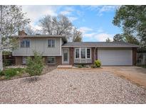 Charming two-story home featuring a brick facade and a well-maintained front yard at 1947 S Ouray St, Aurora, CO 80013