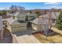 Inviting two-story home featuring a three-car garage and meticulously maintained landscaping at 6690 S Fenton St, Littleton, CO 80123