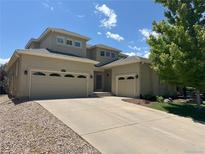 Charming home with a two-car garage, ample driveway space, and a well-maintained lawn at 6690 S Fenton St, Littleton, CO 80123