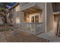 Cozy balcony featuring a seating area, stone accents, and a white railing for relaxing outdoors at 4400 S Quebec St # 107, Denver, CO 80237