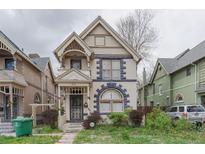 Charming two-story home with unique architectural details and a welcoming front porch at 2245 Julian St, Denver, CO 80211