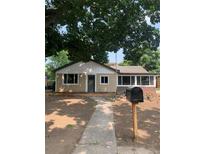 Charming single-story home with fresh exterior paint, updated windows, and a walkway leading to the front door at 3530 Chase St. St, Wheat Ridge, CO 80212