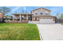 Charming two-story home with a well-maintained front yard and an attached two-car garage at 4510 E 121St Pl, Thornton, CO 80241