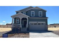 Charming two-story home with a covered porch and a two-car garage at 11052 Snowdon St, Parker, CO 80134