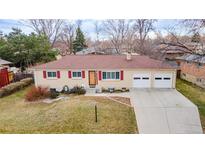 Charming single-story brick home with red shutters and a well-maintained front lawn at 12020 W Center Ave, Lakewood, CO 80228