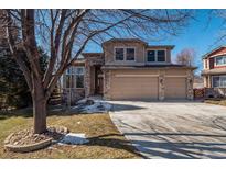 Charming two-story home with stone accents and attached two-car garage at 8493 S Newcombe Way, Littleton, CO 80127