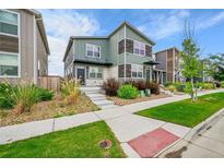 Charming two-story home with landscaped yard, offering an inviting curb appeal and modern design elements at 847 Great Plains Ave, Berthoud, CO 80513
