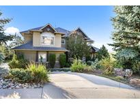 Stunning home with a circular drive and beautiful landscaping at 1159 Buffalo Ridge Rd, Castle Pines, CO 80108