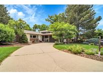 Charming single Gathering home with a landscaped yard and curved driveway at 11496 E Wesley Ave, Aurora, CO 80014