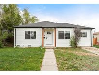 Charming single-story home with a well-manicured lawn and inviting curb appeal at 1213 Jamaica St, Aurora, CO 80010