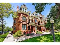 Stunning brick home boasting intricate architectural details and beautiful landscaping at 1001 E 17Th Ave # 12, Denver, CO 80218