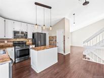 Modern kitchen with stainless steel appliances and island at 19136 E Milan Cir, Aurora, CO 80013