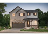 Charming two-story home featuring a stone facade, gray siding and a two-car garage at 2184 S Ider Way, Aurora, CO 80018
